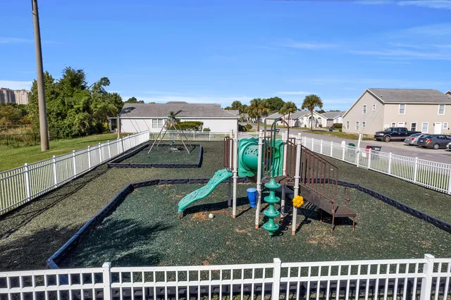 a view of a chair and tables in the patio