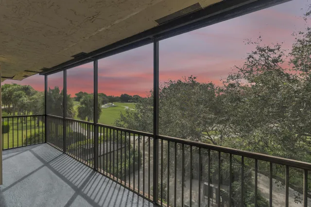 a view of a balcony with wooden floor