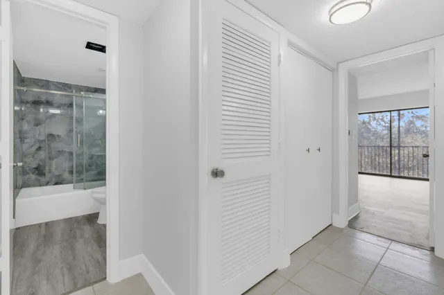 a view of a bathroom with a glass door
