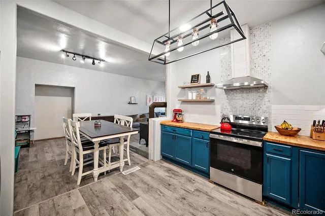a kitchen with stainless steel appliances granite countertop a sink and cabinets