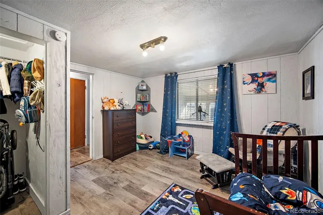 a bedroom with furniture and a bed