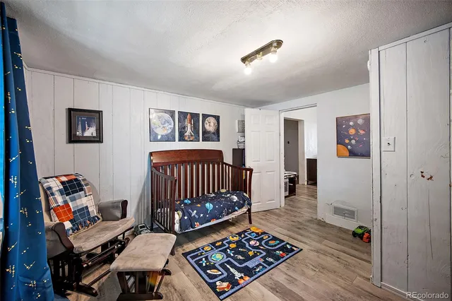 a bedroom with furniture and a window