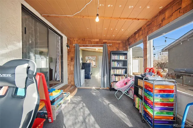a bedroom with furniture and a gym equipment