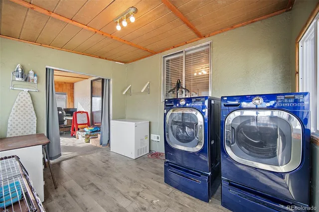 a view of a livingroom with furniture and a window