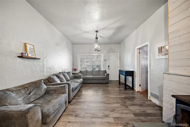a living room with furniture windows and a fireplace
