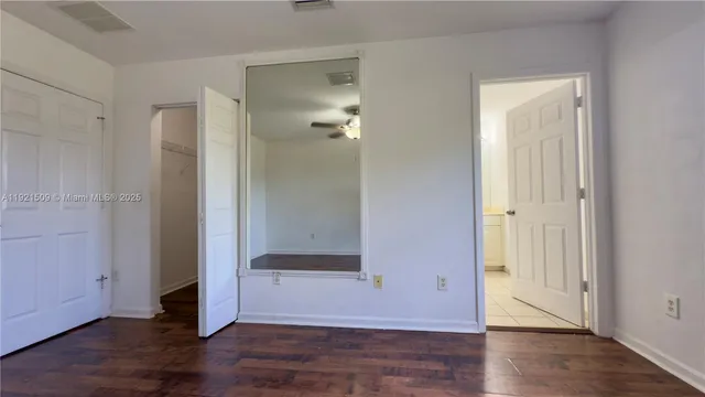 a view of a bathroom with wooden floor
