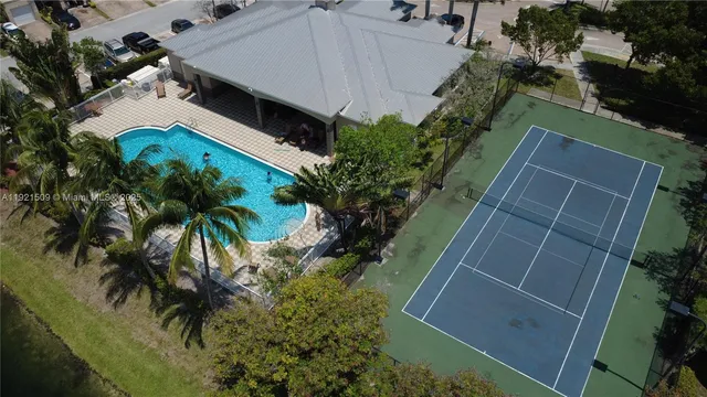 an aerial view of house with yard