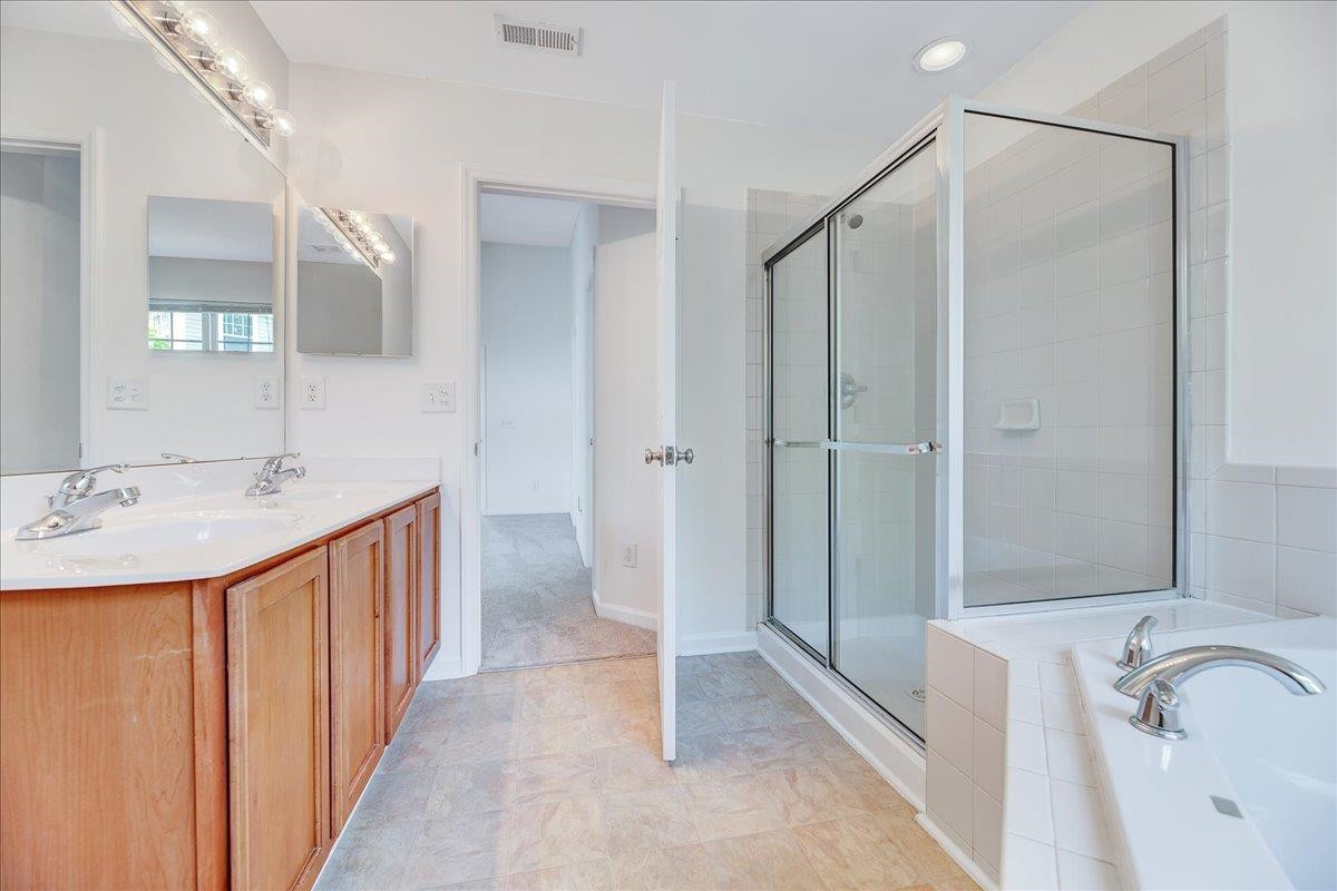 11838 Canemount Street Raleigh, NC 27614 - Photo 22 of 34 a bathroom with a granite countertop sink and a shower