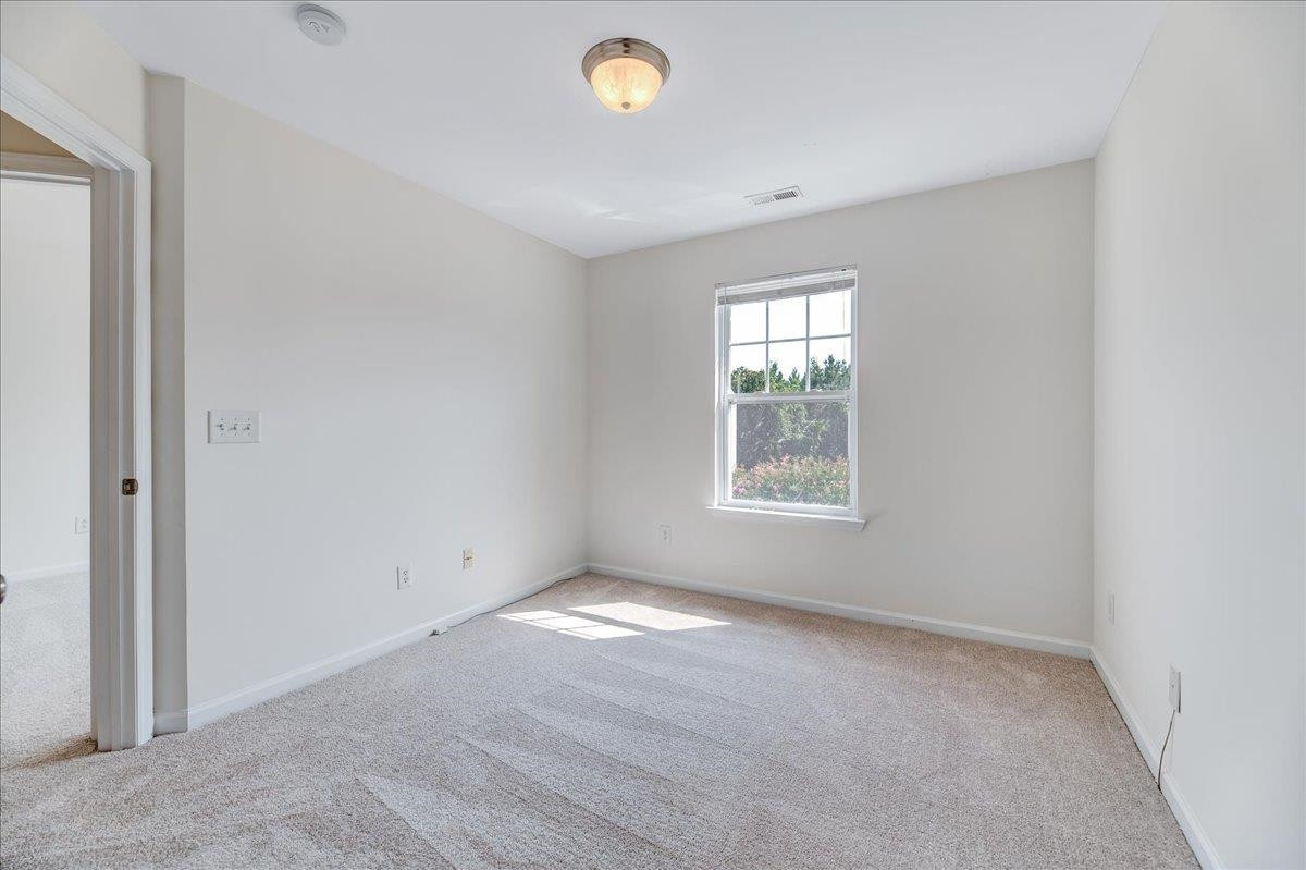 11838 Canemount Street Raleigh, NC 27614 - Photo 24 of 34 an empty room with a window