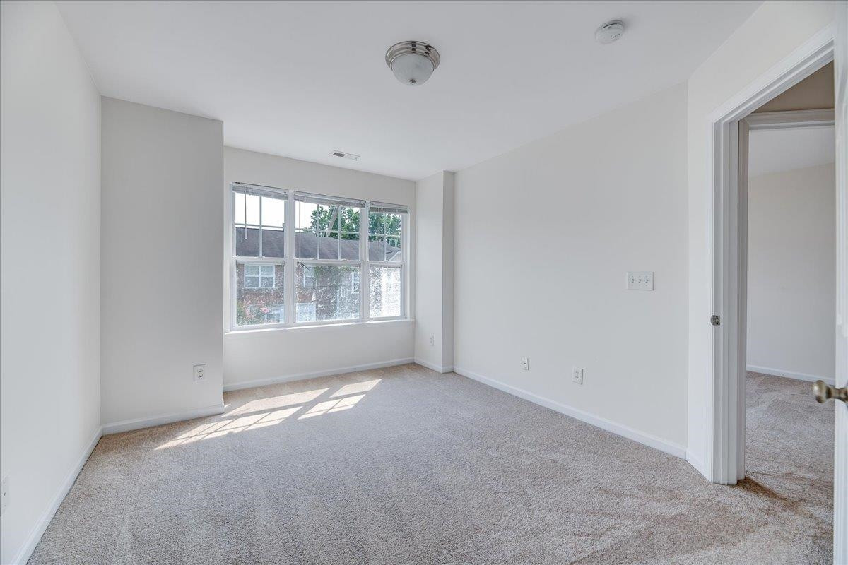 11838 Canemount Street Raleigh, NC 27614 - Photo 26 of 34 an empty room with windows