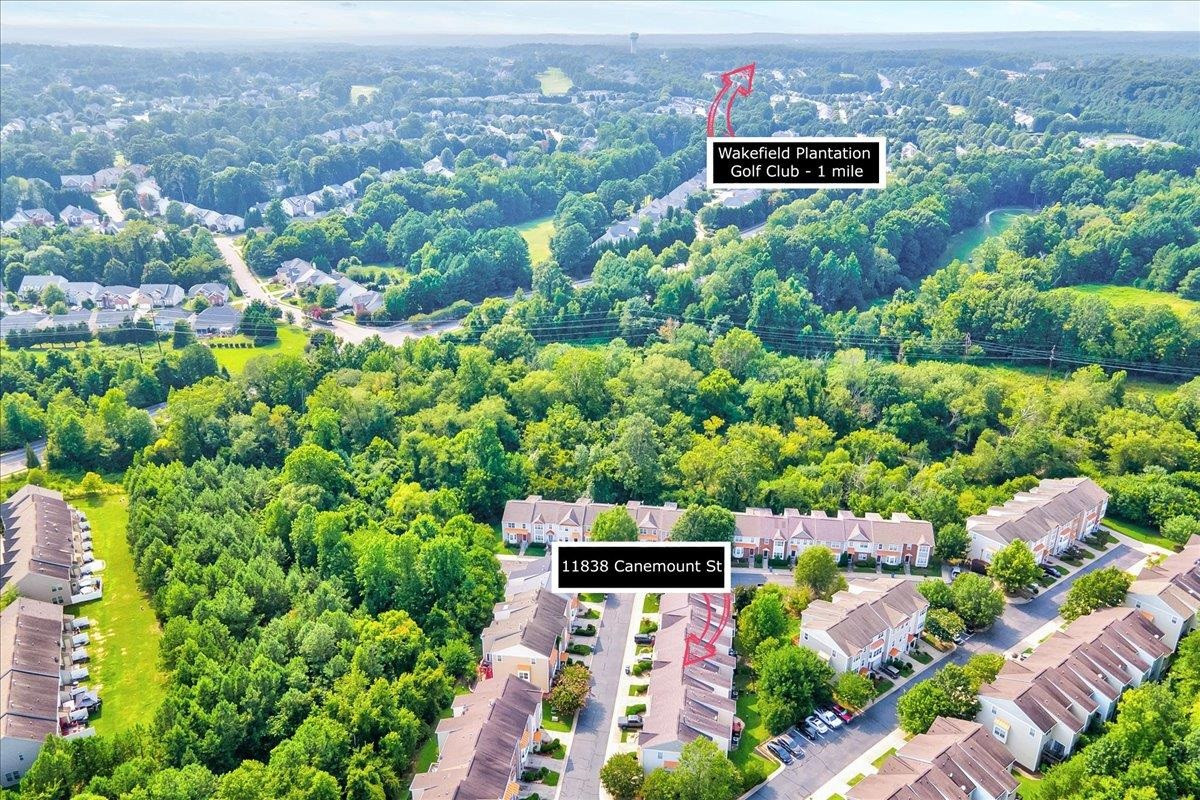11838 Canemount Street Raleigh, NC 27614 - Photo 33 of 34 an aerial view of a houses with a yard