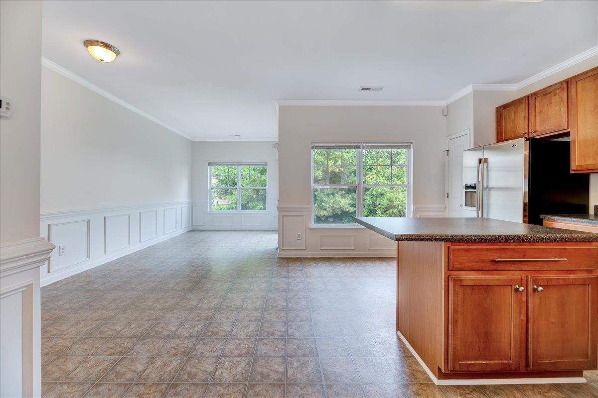 11838 Canemount Street Raleigh, NC 27614 - Photo 6 of 34 a view of livingroom with hardwood floor and a window