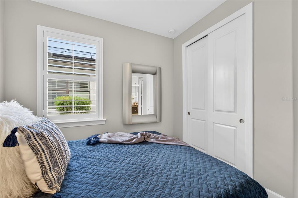 1721 Hyssop Loop North Port, FL 34289 - Photo 23 of 70 a view of a bedroom with wooden floor and a window