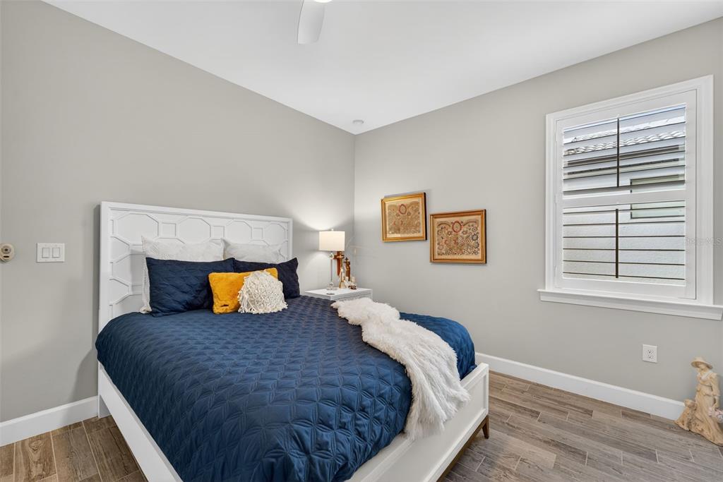 1721 Hyssop Loop North Port, FL 34289 - Photo 24 of 70 a bedroom with a bed and wooden floor