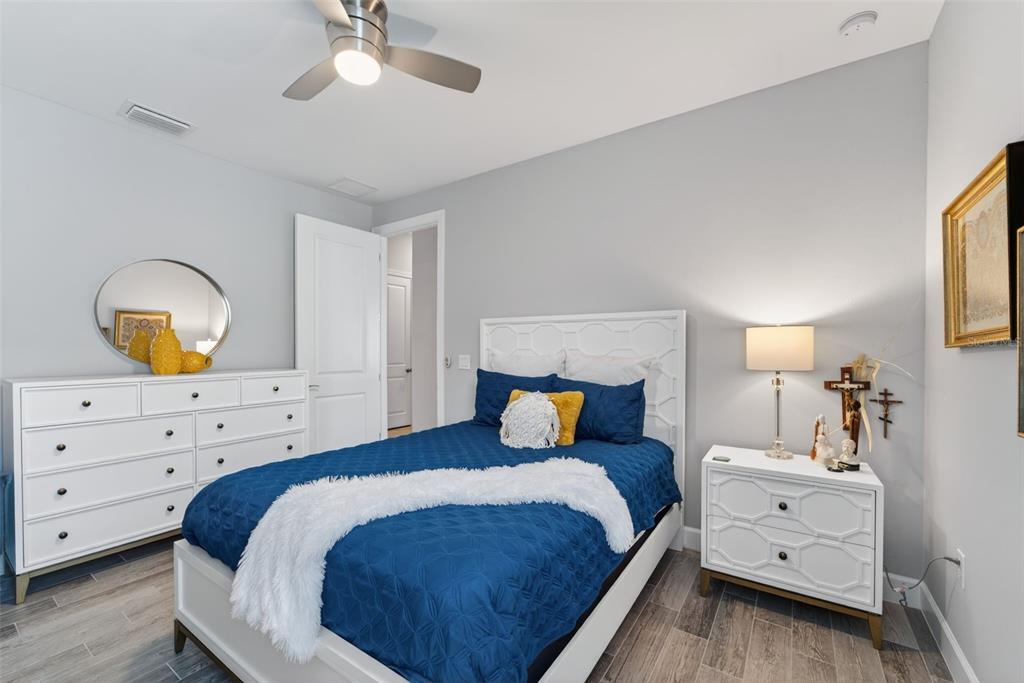 1721 Hyssop Loop North Port, FL 34289 - Photo 25 of 70 a bedroom with a bed and a dresser