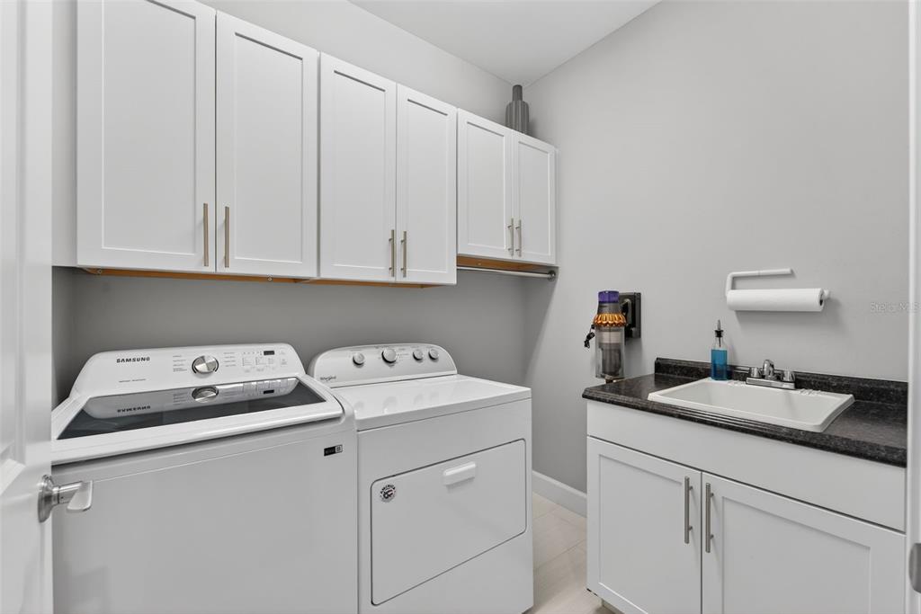 1721 Hyssop Loop North Port, FL 34289 - Photo 26 of 70 a utility room with sink dryer and washer