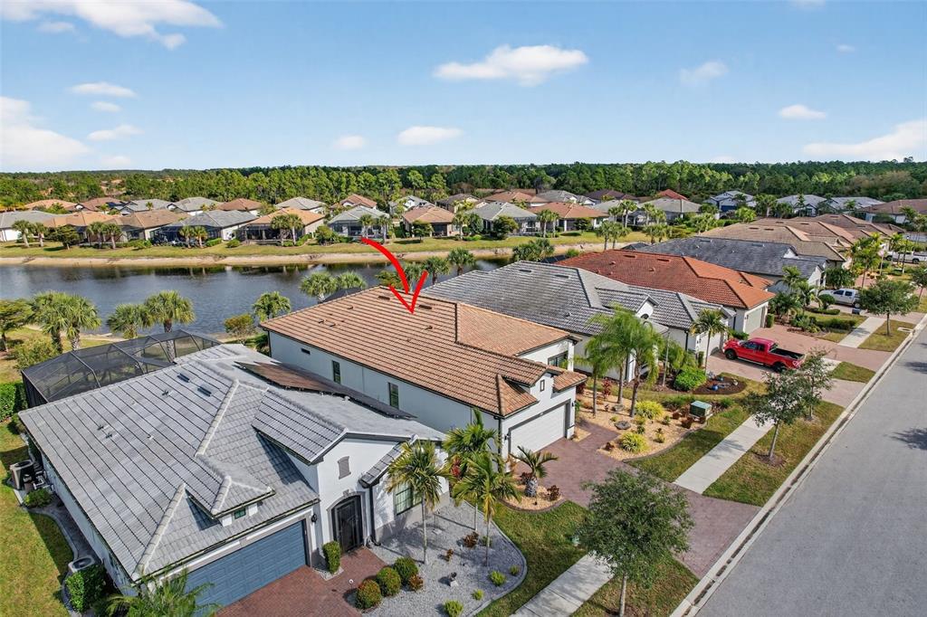 1721 Hyssop Loop North Port, FL 34289 - Photo 45 of 70 an aerial view of a house with a lake view