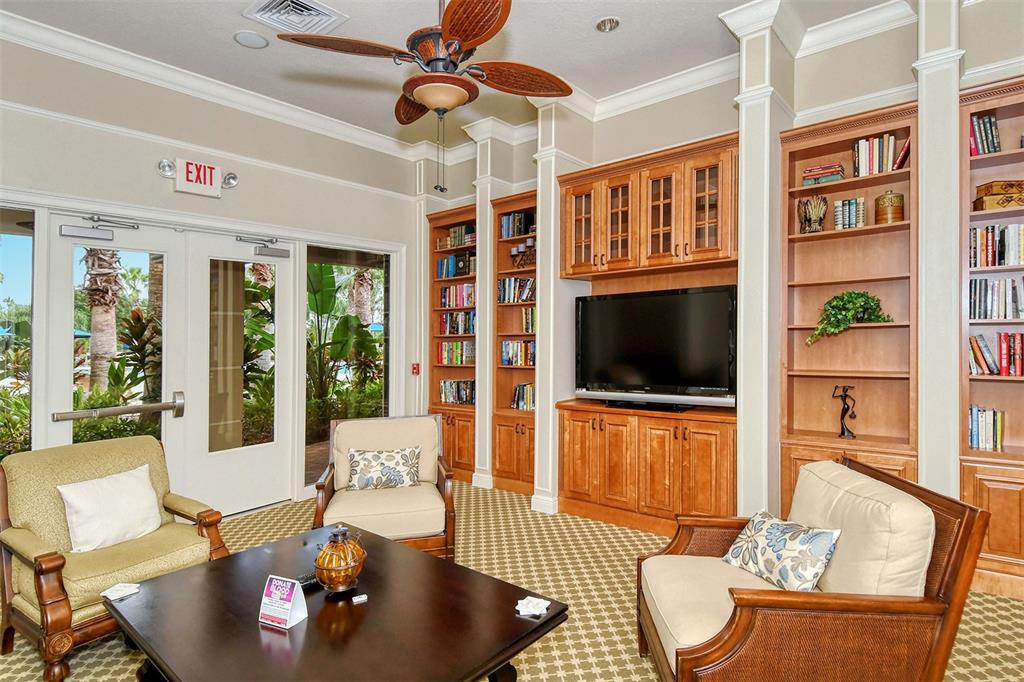 1721 Hyssop Loop North Port, FL 34289 - Photo 55 of 70 a living room with furniture and a flat screen tv