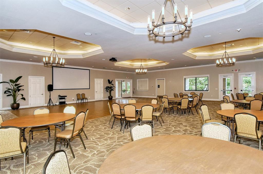 1721 Hyssop Loop North Port, FL 34289 - Photo 56 of 70 a view of a dining room with furniture and chandelier