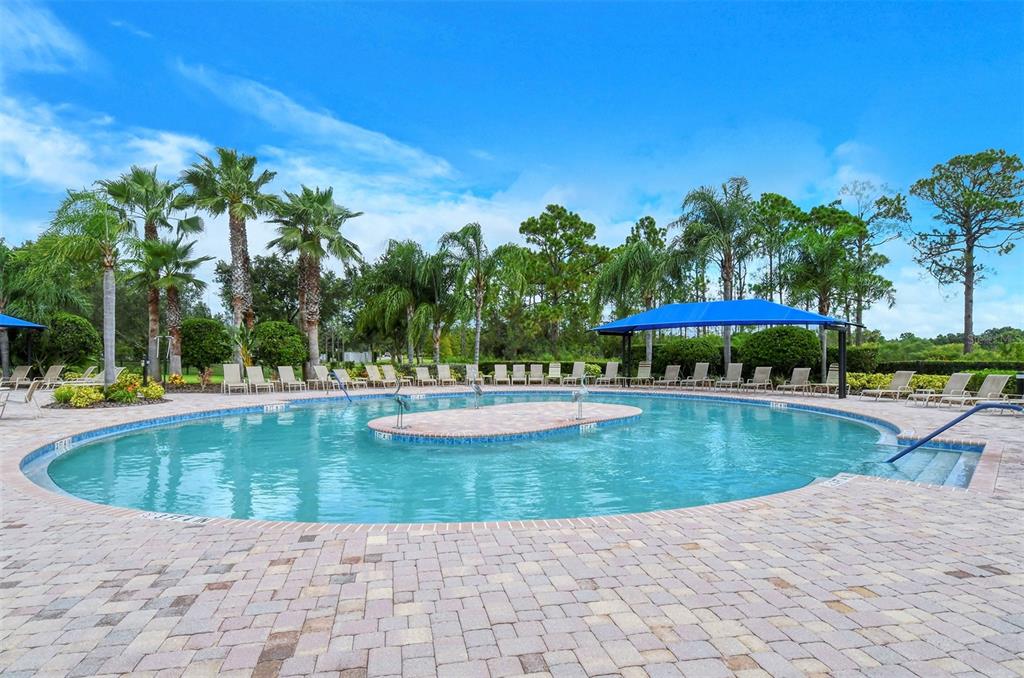 1721 Hyssop Loop North Port, FL 34289 - Photo 57 of 70 a view of a swimming pool and lounge chairs