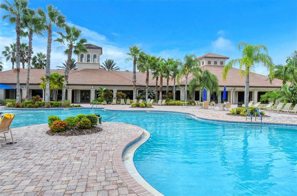 1721 Hyssop Loop North Port, FL 34289 - Photo 58 of 70 a front view of a house with swimming pool having outdoor seating