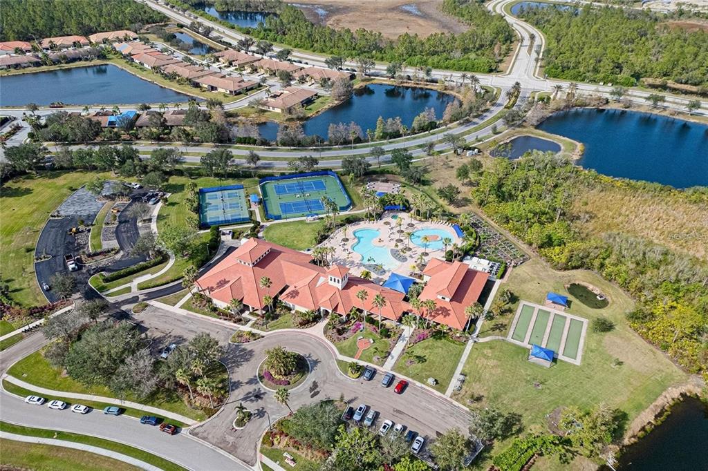 1721 Hyssop Loop North Port, FL 34289 - Photo 70 of 70 an aerial view of a house with a garden and lake view