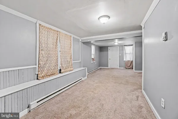 a view of an empty room and window