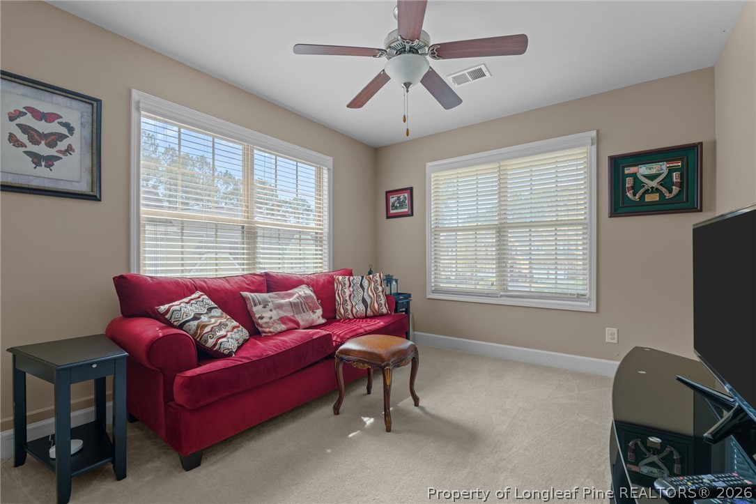 126 Pine Hawk Drive Spring Lake, NC 28390 - Photo 27 of 48 a living room with furniture and a window