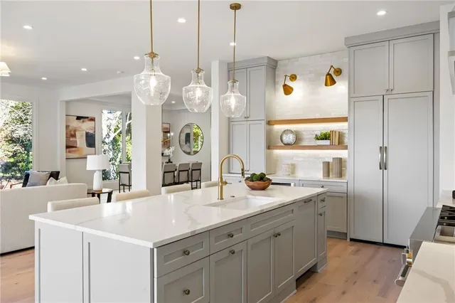 a spacious bathroom with a sink a mirror and a shower