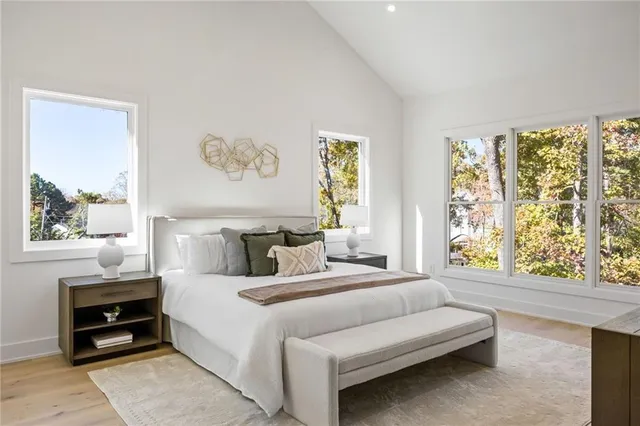 a bedroom with a bed and a couch