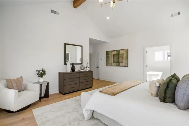 a bedroom with furniture and a window