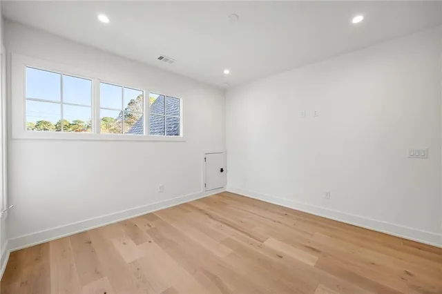 a bathroom with a granite countertop sink toilet a mirror and a bathtub