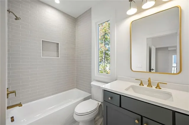 a sink with white cabinets