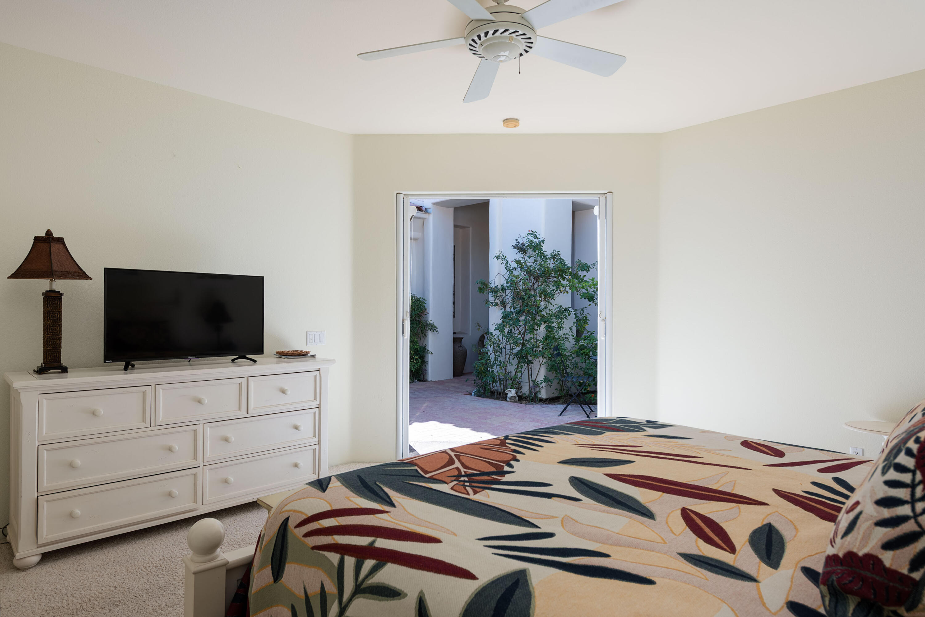 278 Loch Lomond Road Rancho Mirage, CA 92270 - Photo 12 of 49 a bedroom with a bed and a flat screen tv