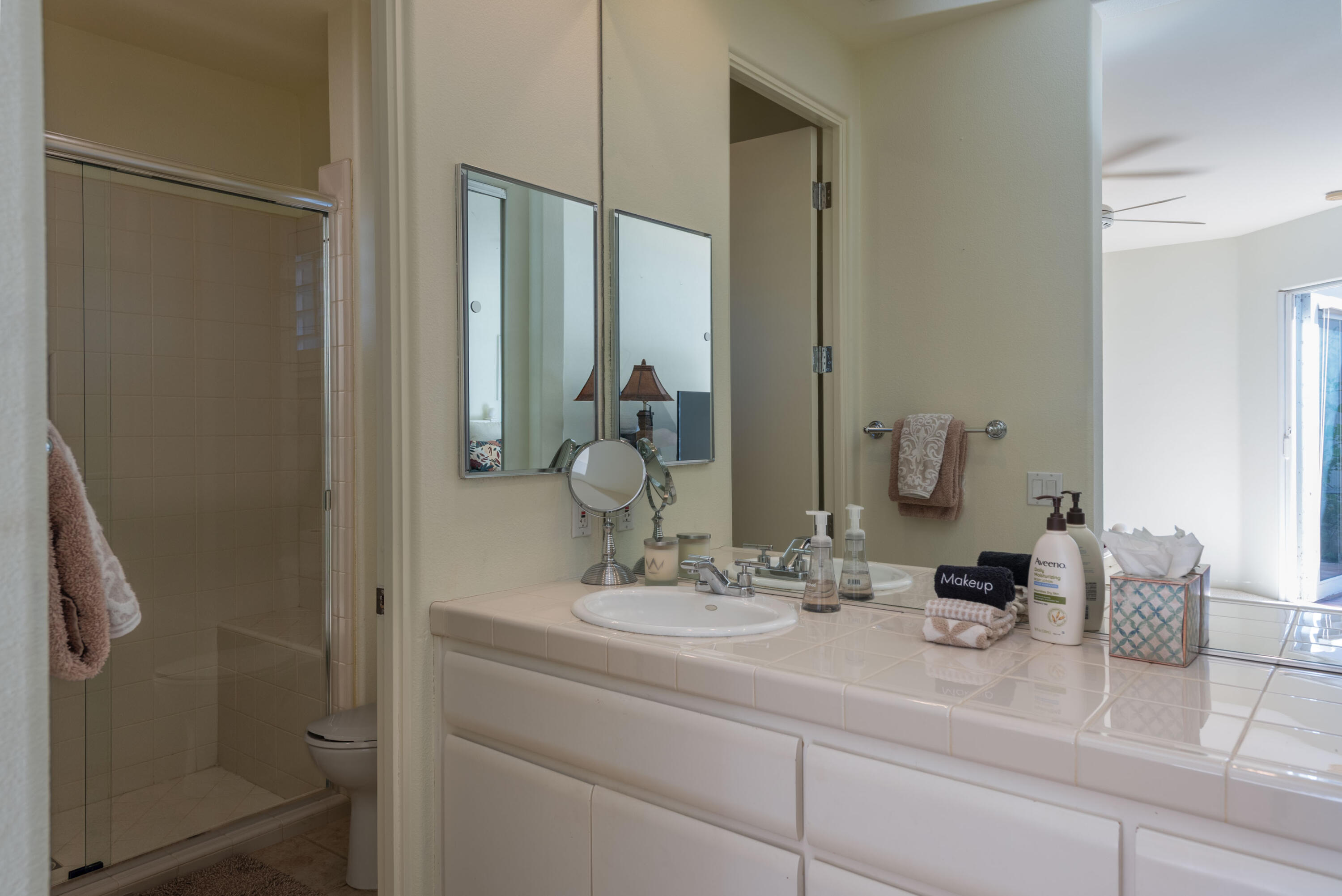 278 Loch Lomond Road Rancho Mirage, CA 92270 - Photo 13 of 49 a bathroom with a sink and a mirror