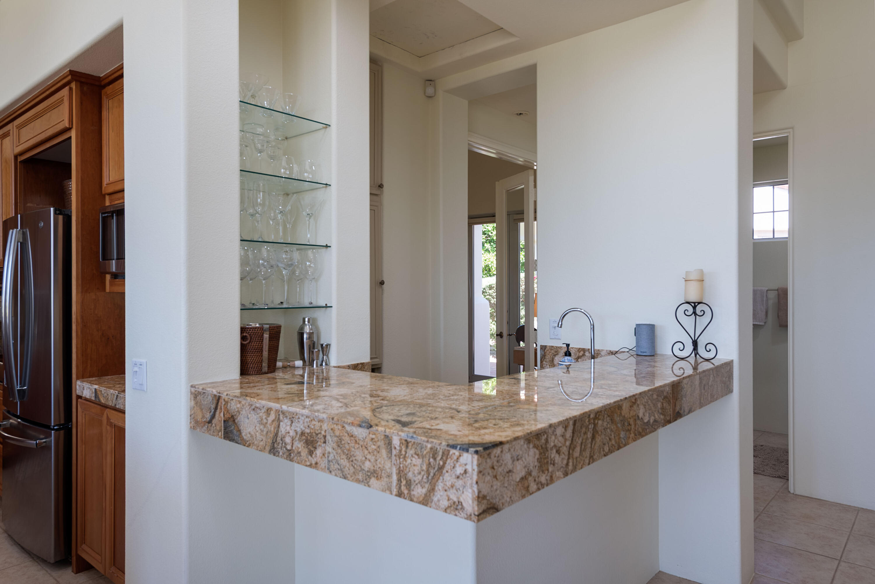 278 Loch Lomond Road Rancho Mirage, CA 92270 - Photo 22 of 49 a bathroom with a granite countertop sink and a mirror
