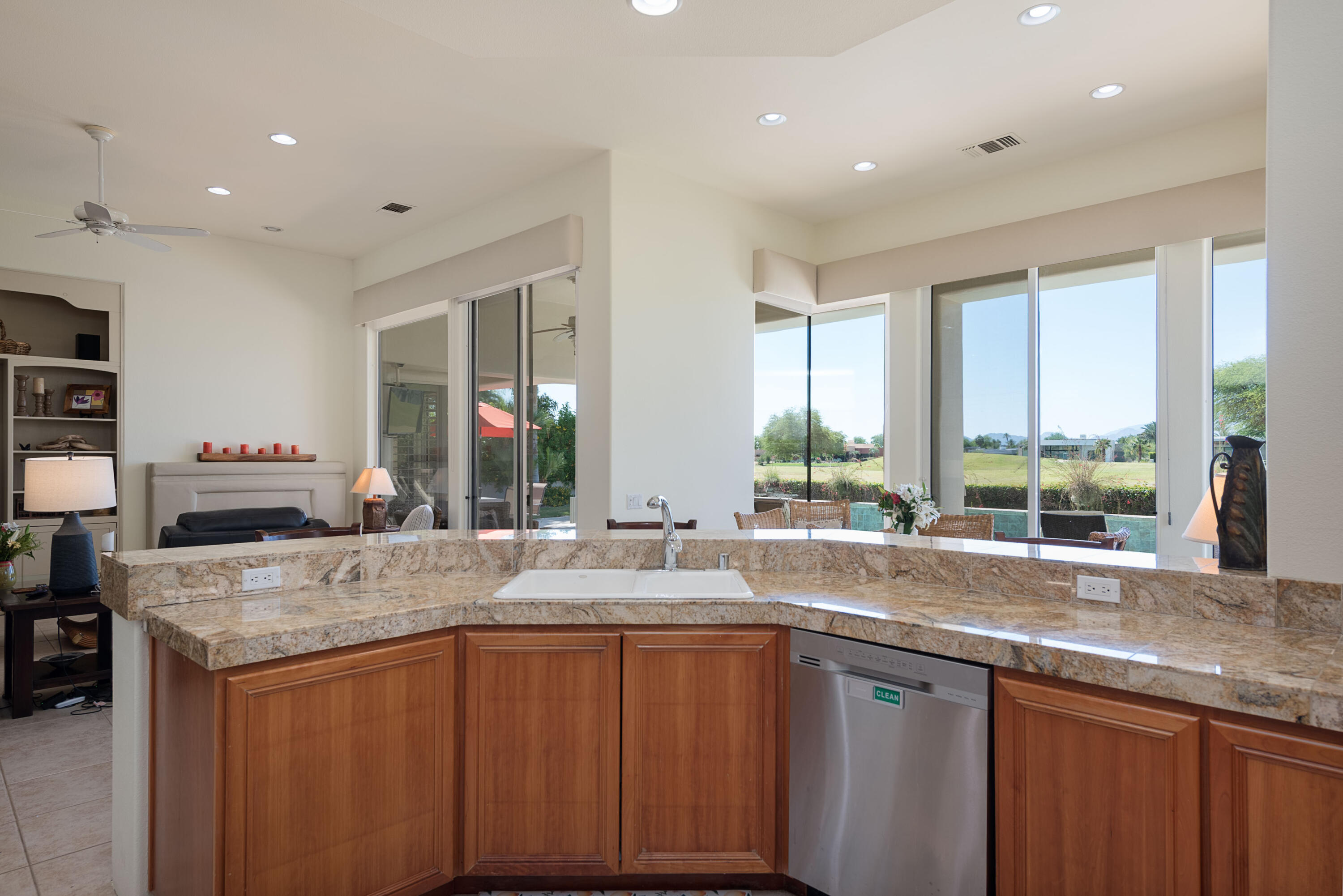278 Loch Lomond Road Rancho Mirage, CA 92270 - Photo 26 of 49 a kitchen with granite countertop a sink and a window