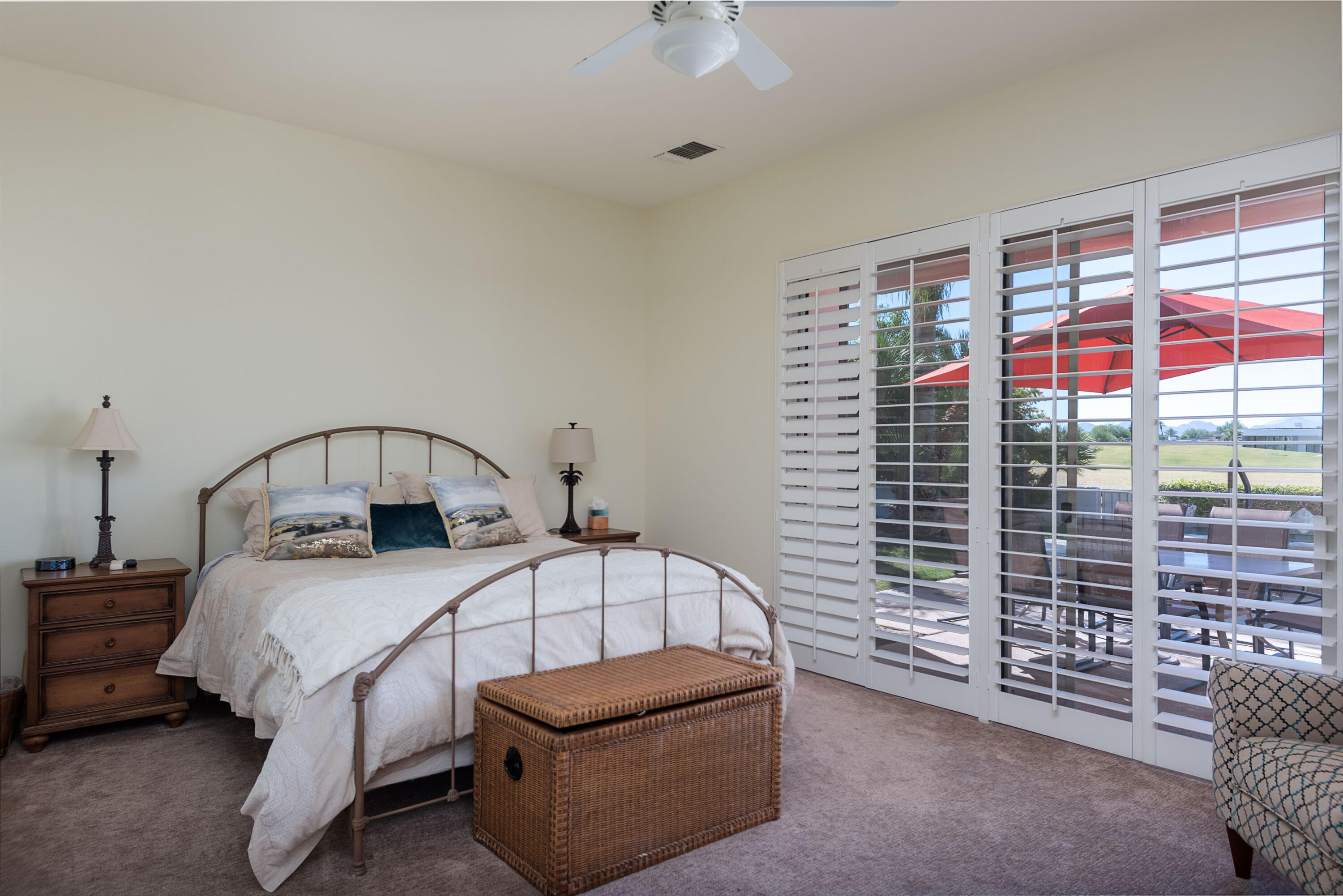 278 Loch Lomond Road Rancho Mirage, CA 92270 - Photo 27 of 49 a bedroom with a bed and a chandelier