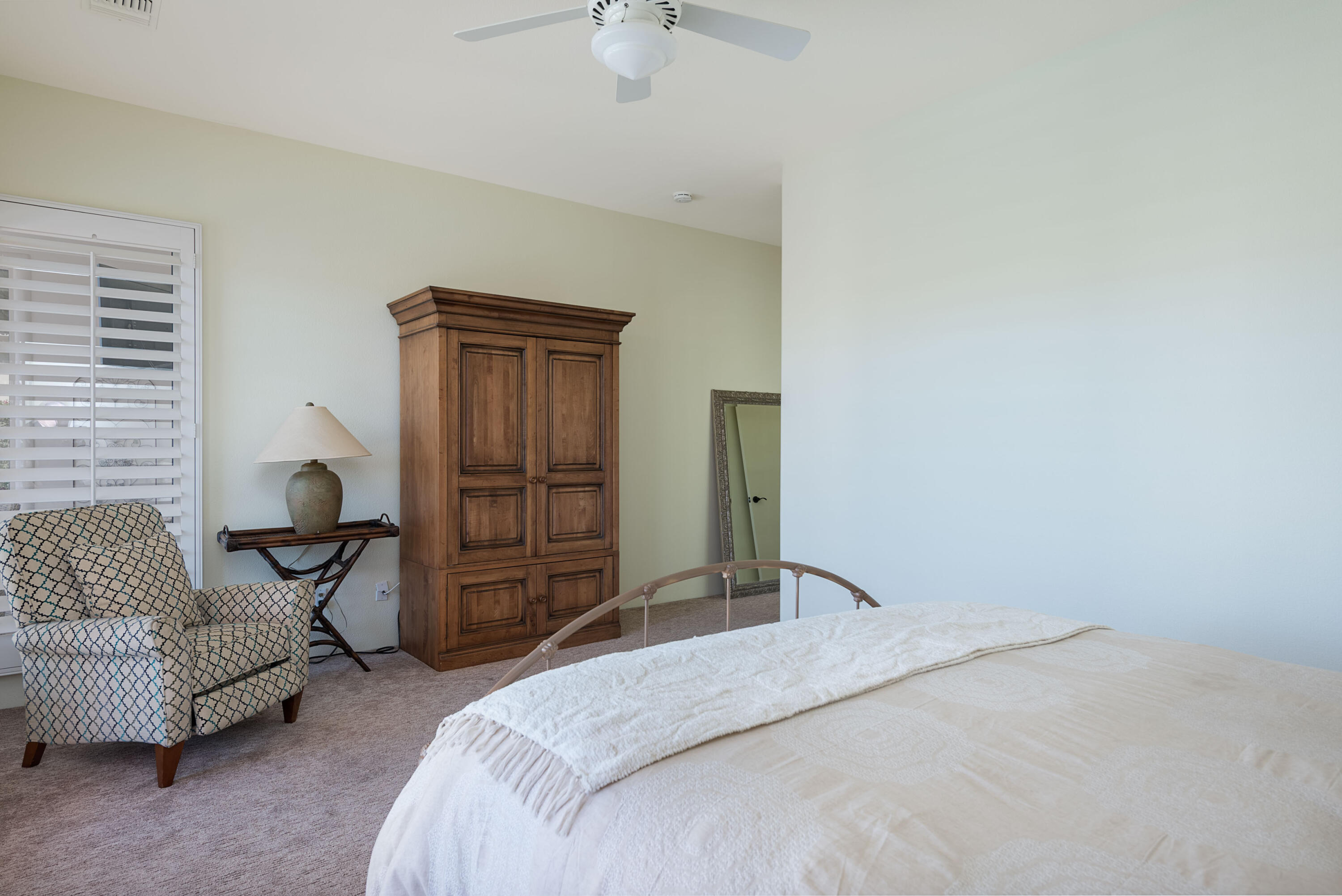278 Loch Lomond Road Rancho Mirage, CA 92270 - Photo 28 of 49 a bedroom with a bed and dresser