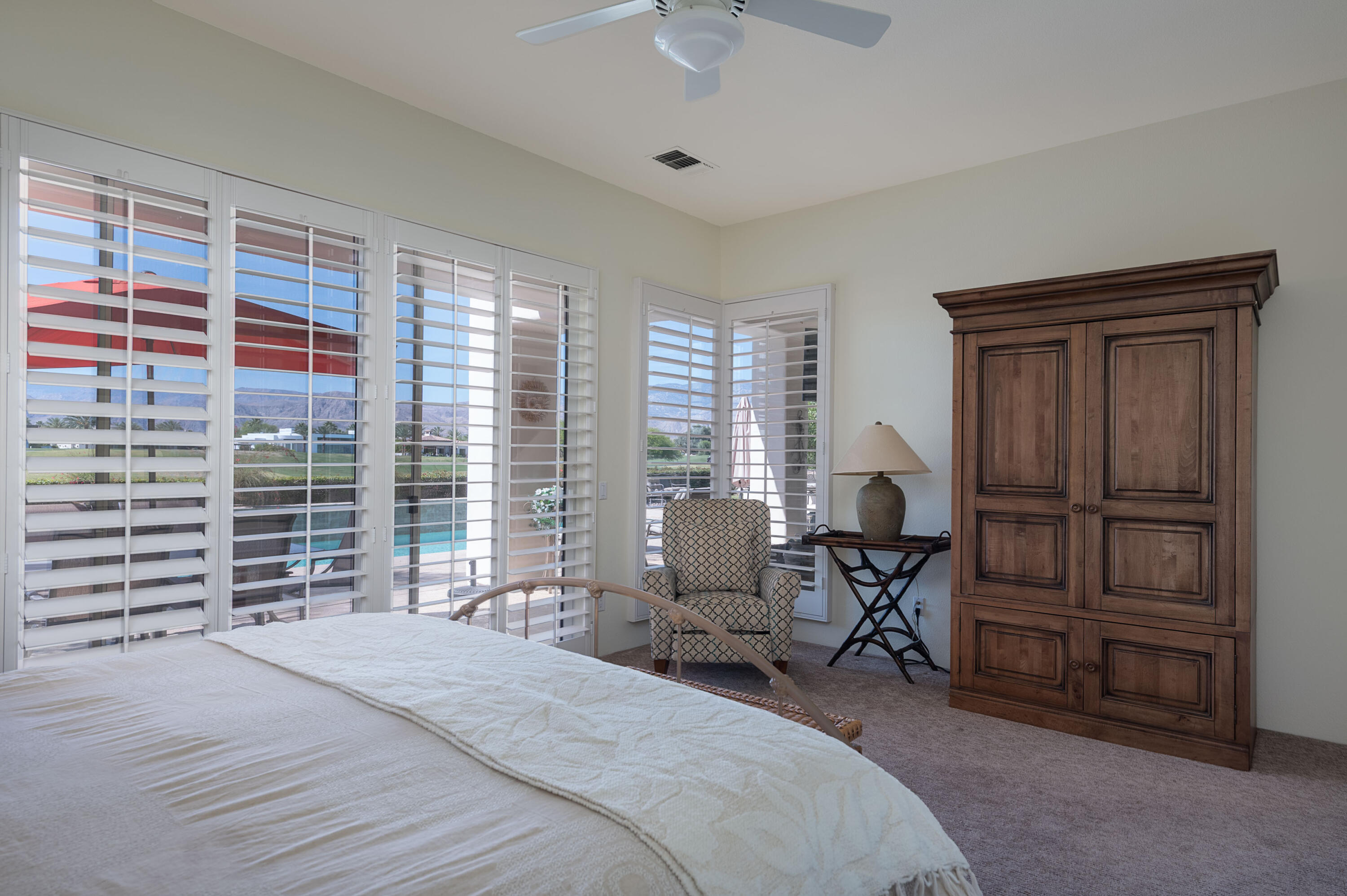 278 Loch Lomond Road Rancho Mirage, CA 92270 - Photo 29 of 49 a bedroom with a bed and furniture