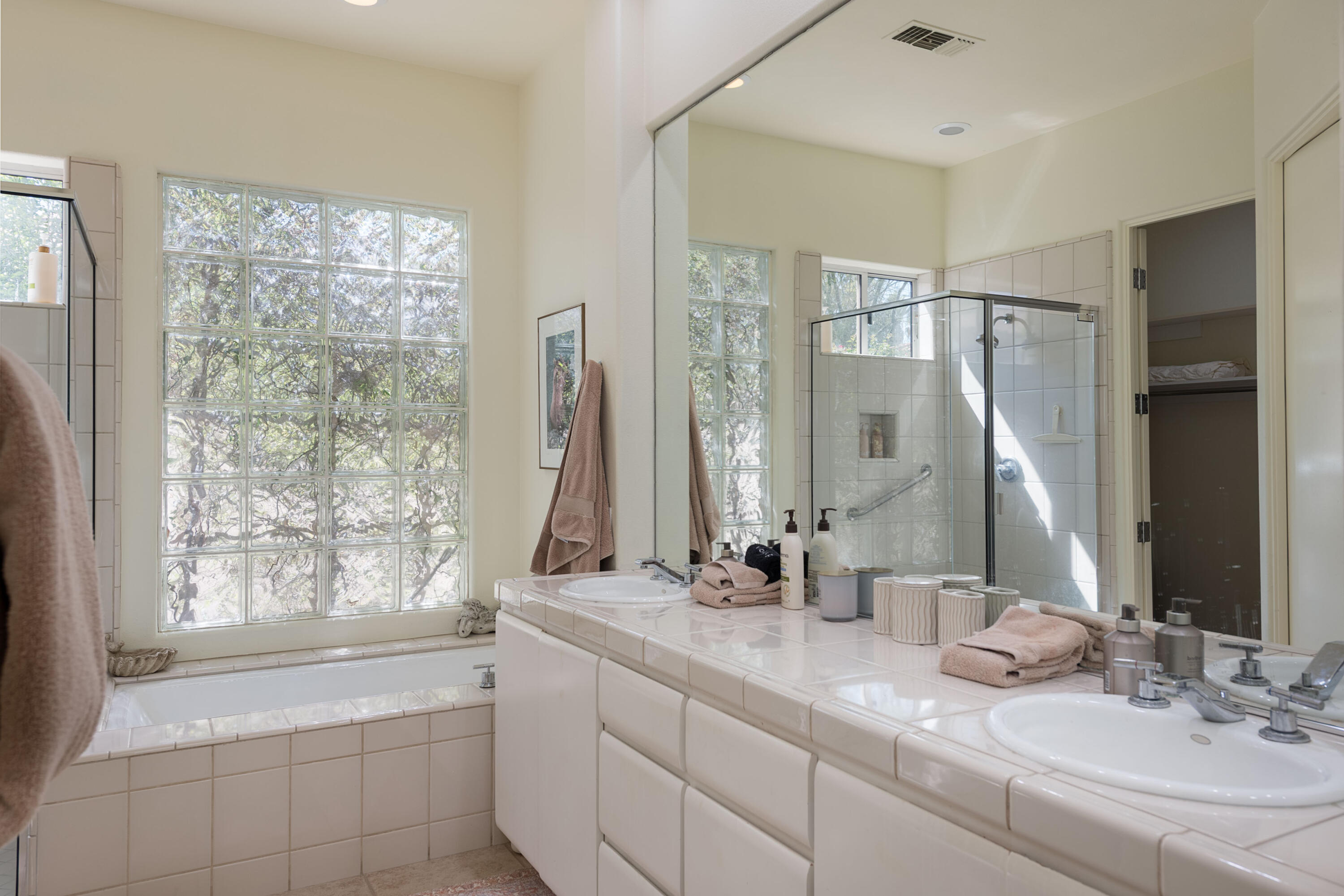 278 Loch Lomond Road Rancho Mirage, CA 92270 - Photo 31 of 49 a bathroom with double vanity sinks and a mirror