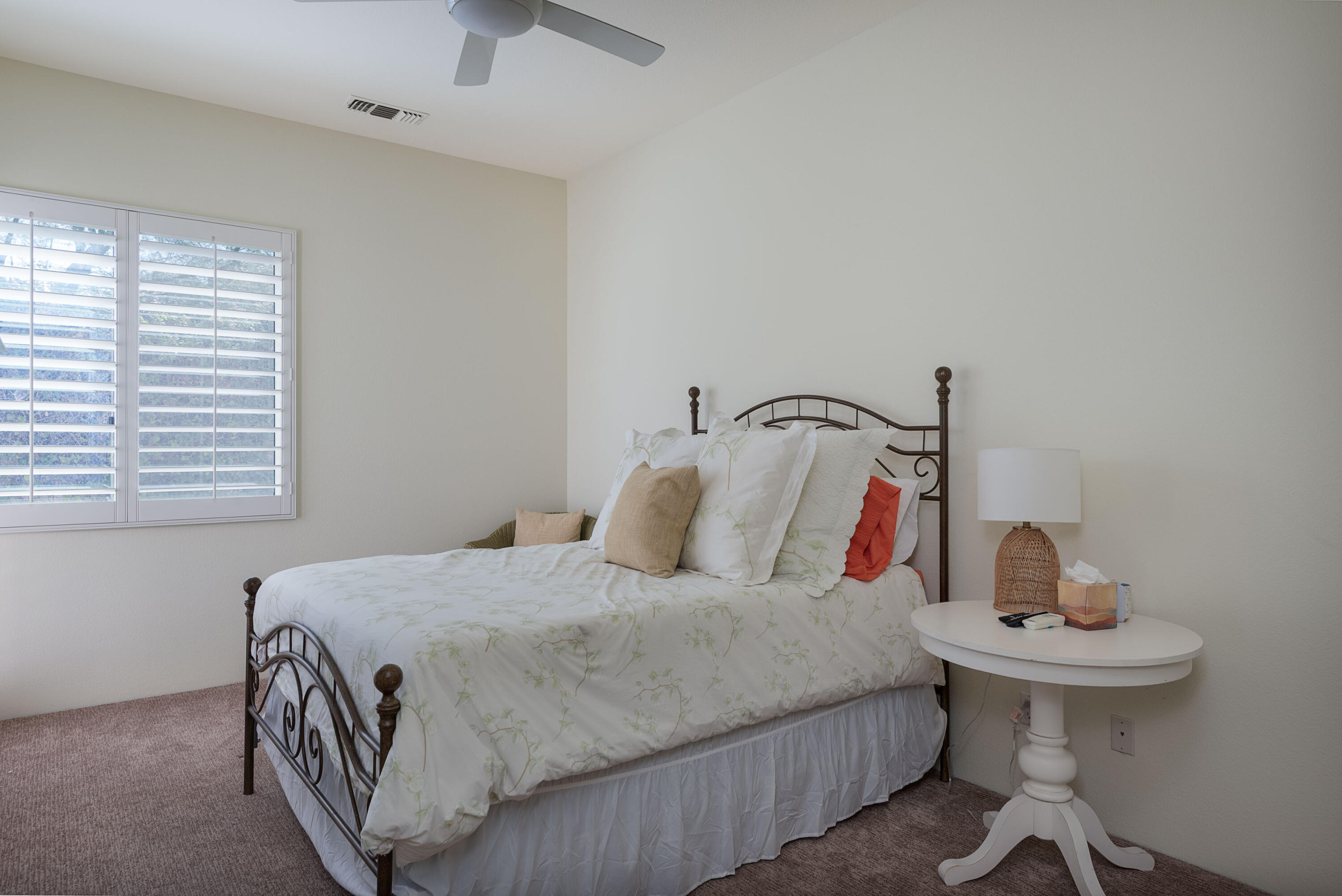 278 Loch Lomond Road Rancho Mirage, CA 92270 - Photo 33 of 49 a bedroom with a bed and a table