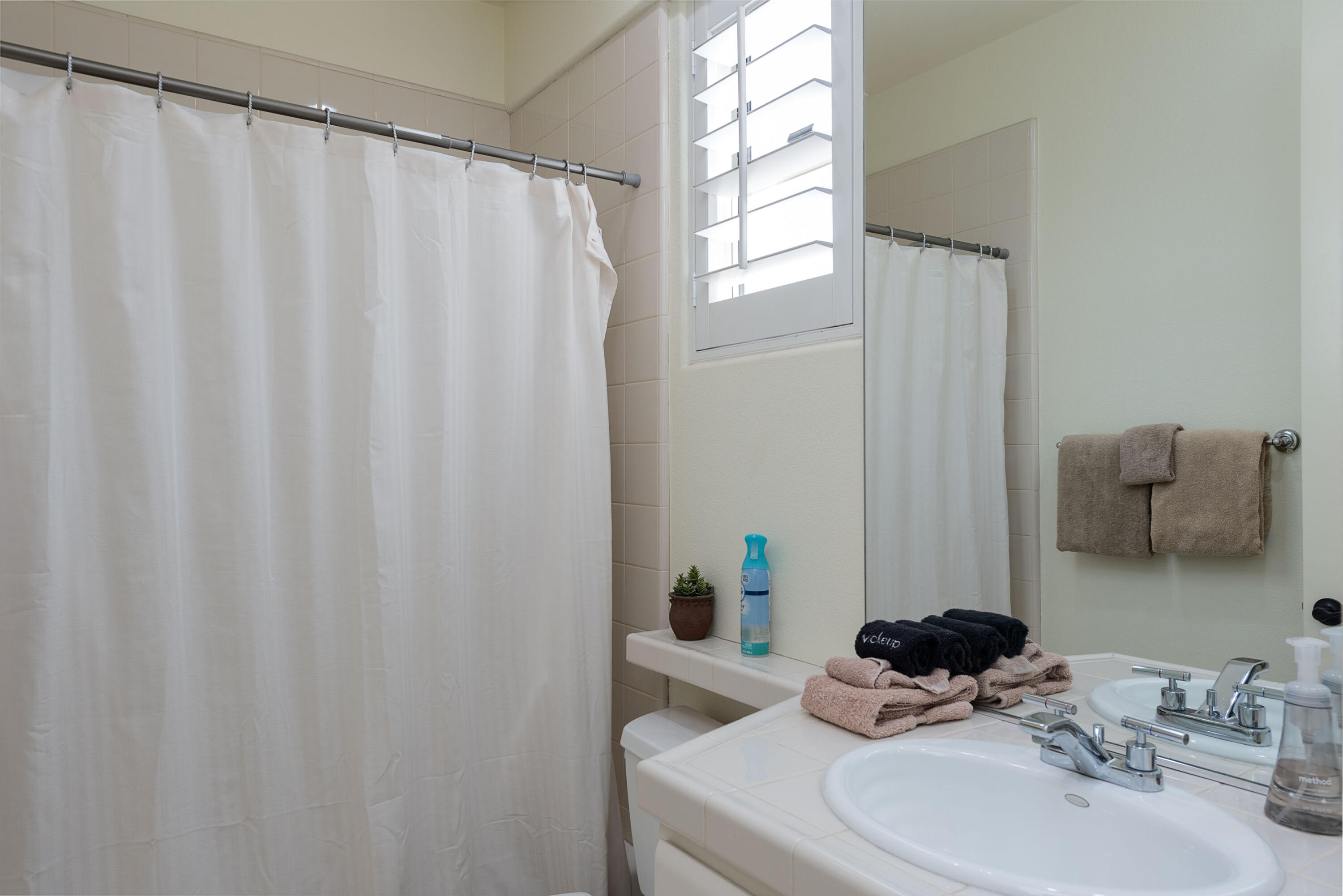 278 Loch Lomond Road Rancho Mirage, CA 92270 - Photo 35 of 49 a bathroom with a sink and a mirror