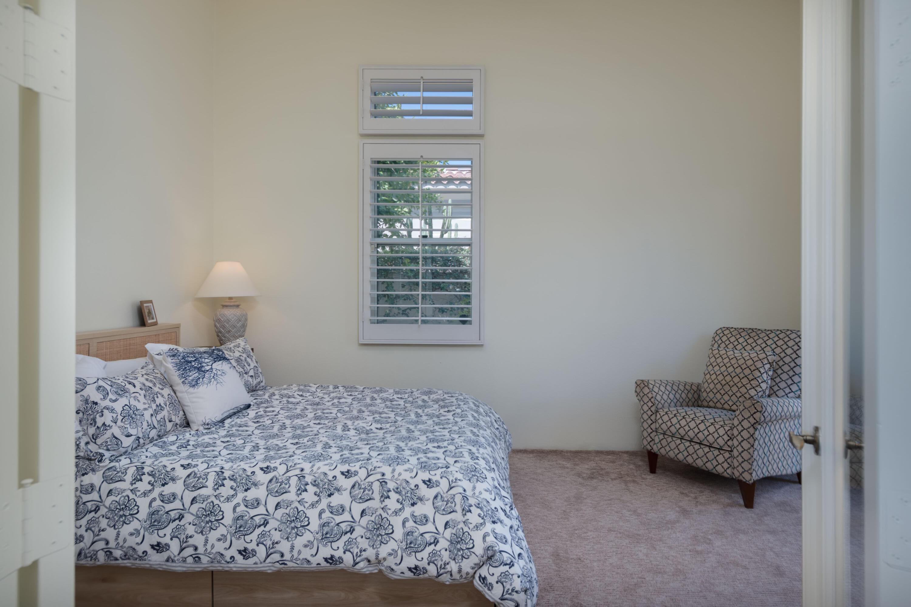 278 Loch Lomond Road Rancho Mirage, CA 92270 - Photo 36 of 49 a bedroom with a bed couch and window