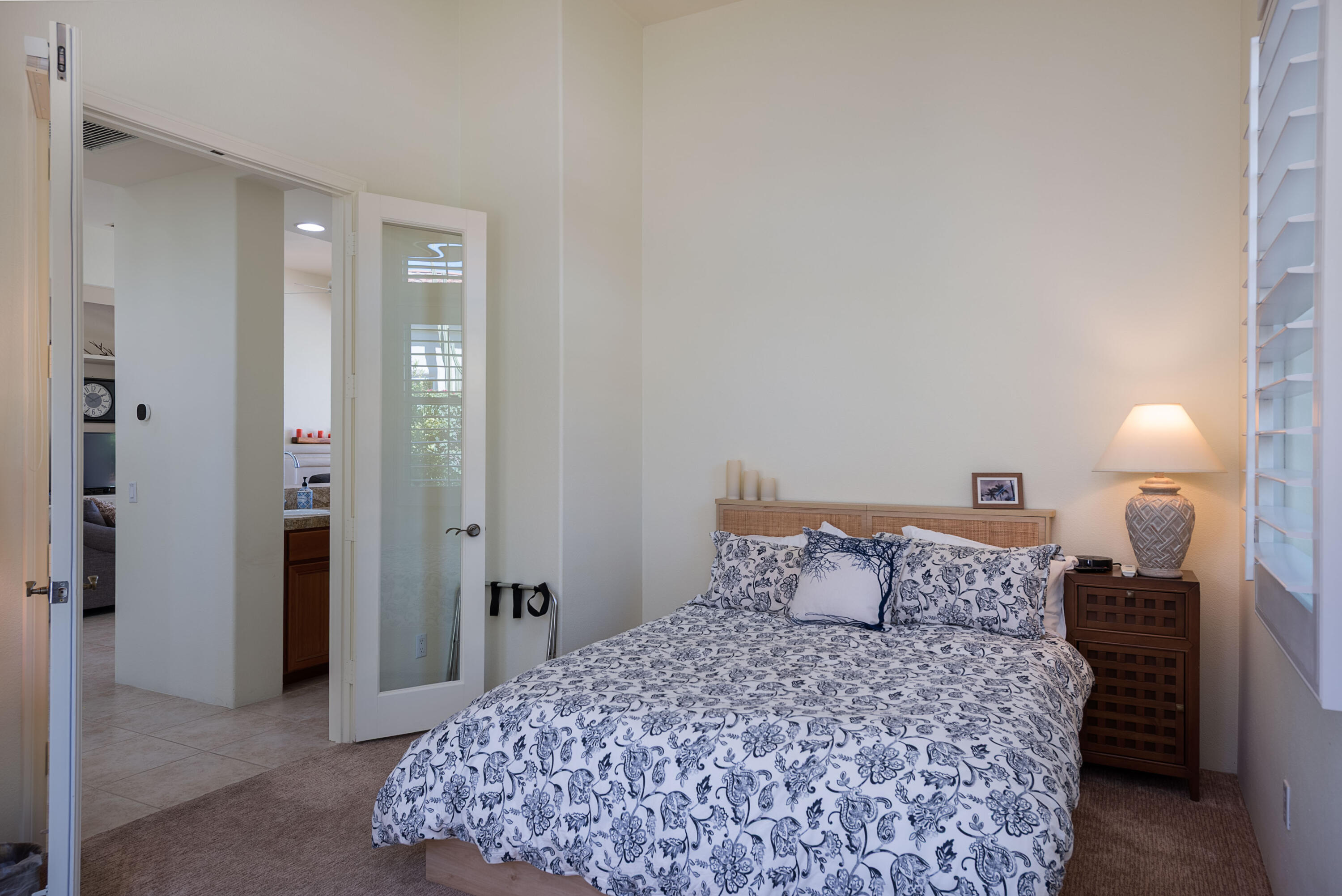 278 Loch Lomond Road Rancho Mirage, CA 92270 - Photo 37 of 49 a bedroom with a bed and a lamp