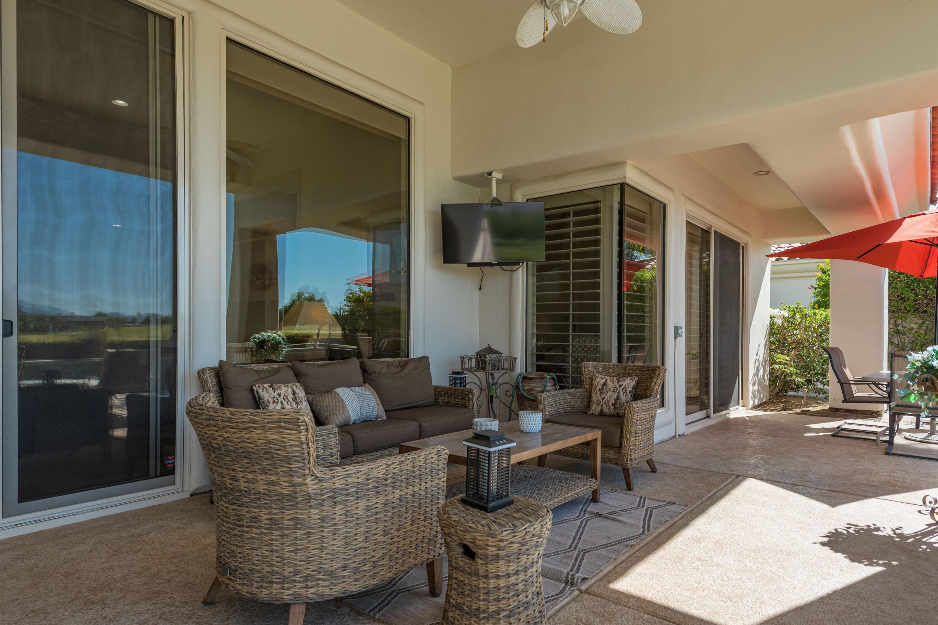 278 Loch Lomond Road Rancho Mirage, CA 92270 - Photo 40 of 49 a living room with furniture and a fireplace