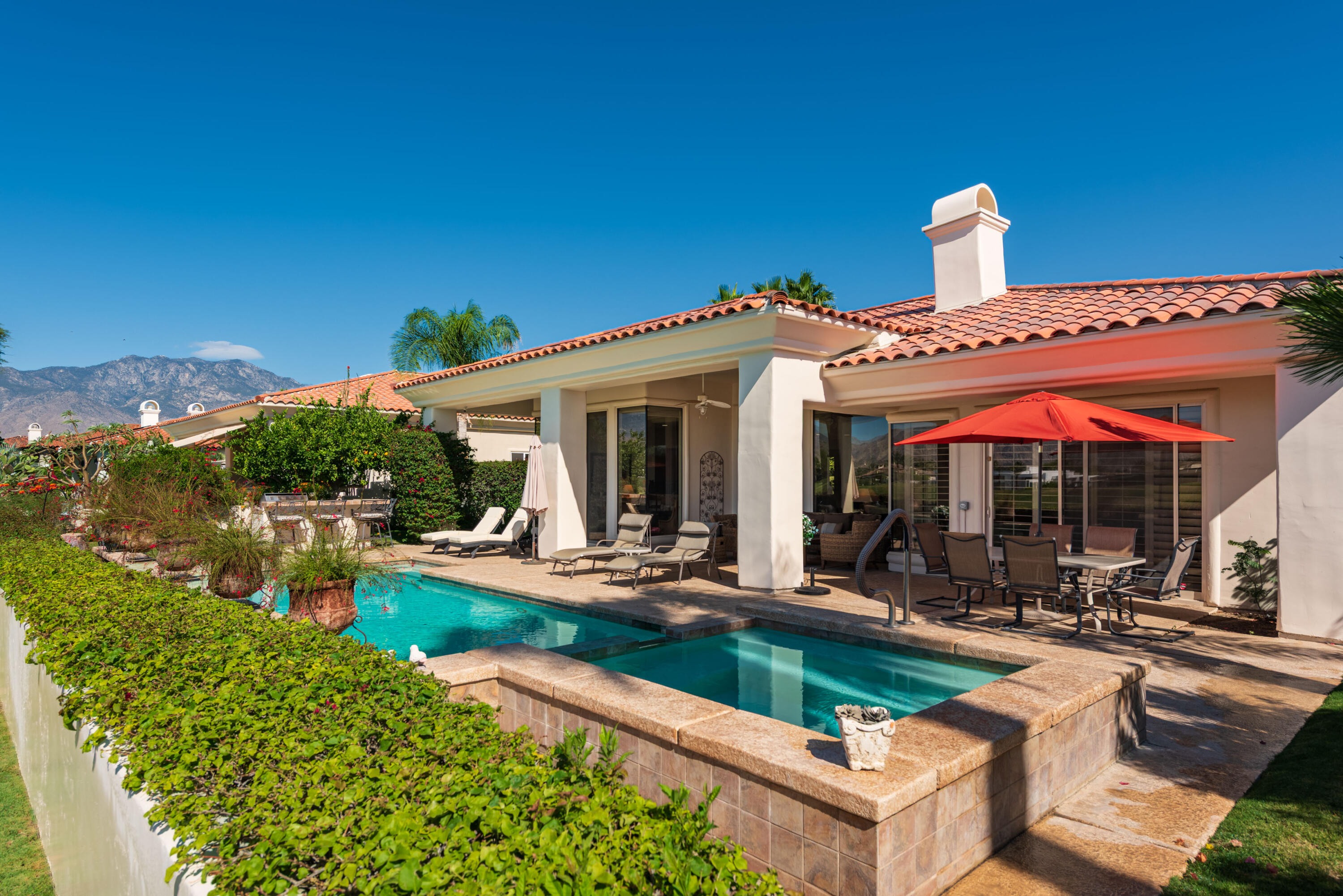 278 Loch Lomond Road Rancho Mirage, CA 92270 - Photo 43 of 49 a view of a house with swimming pool and sitting area