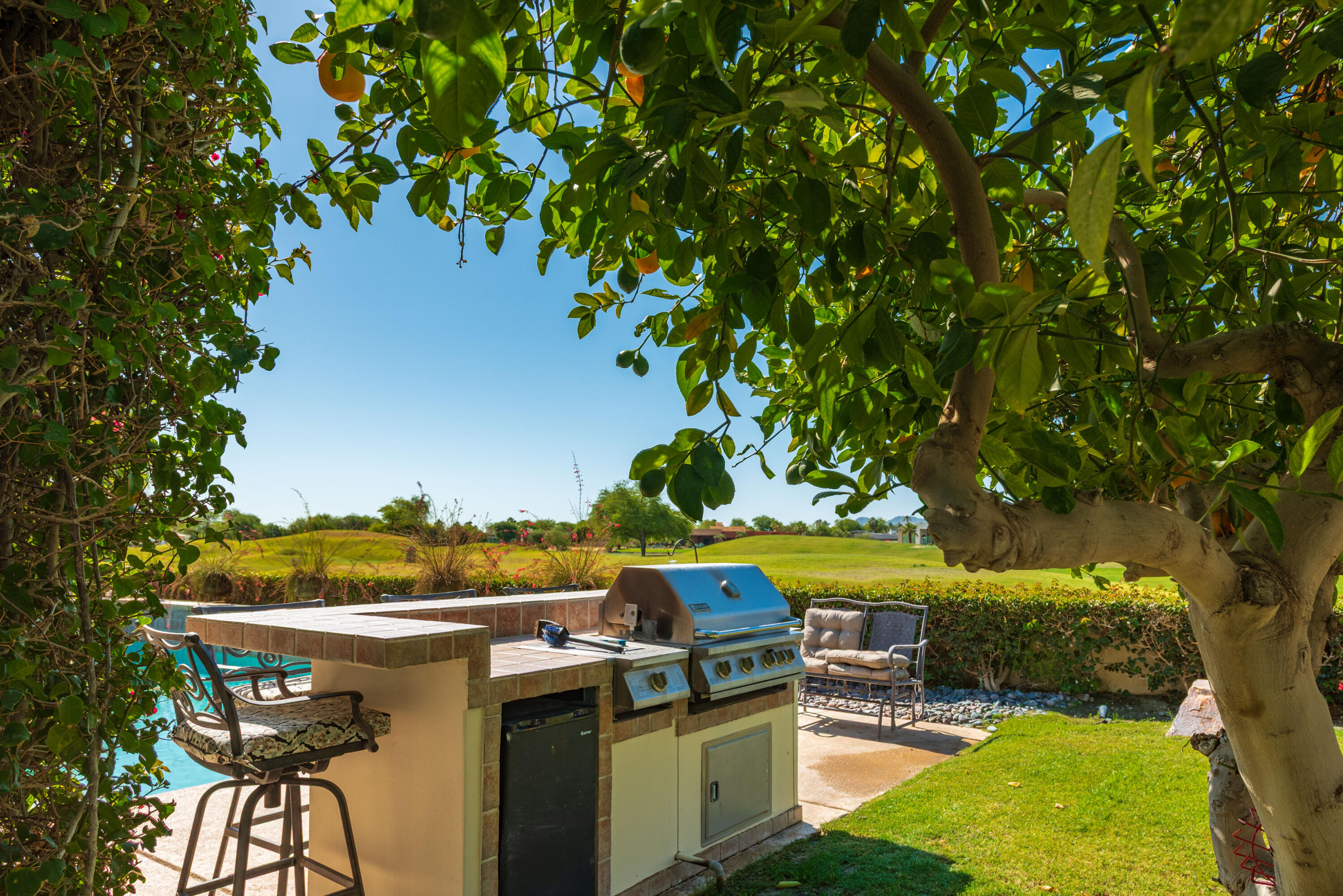 278 Loch Lomond Road Rancho Mirage, CA 92270 - Photo 45 of 49 a view of a kitchen with a table and chairs