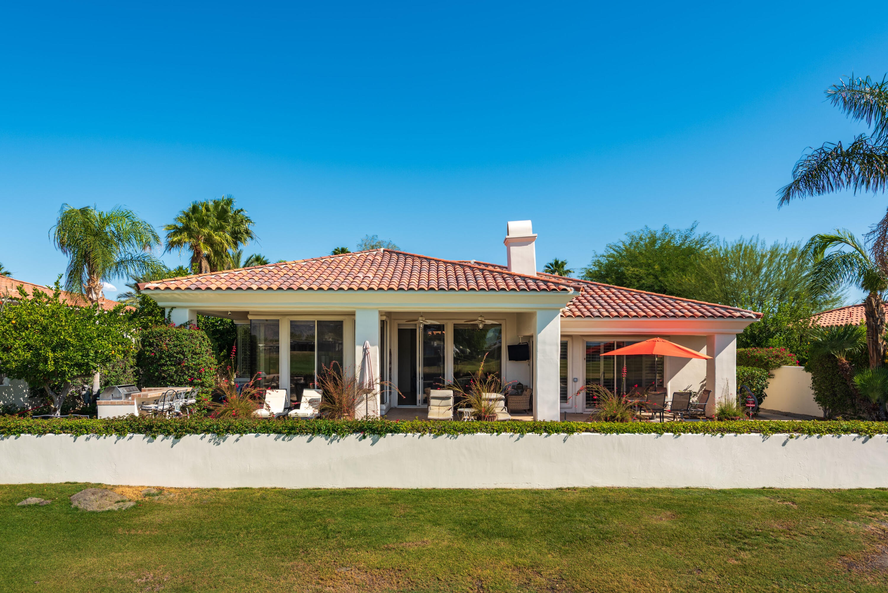 278 Loch Lomond Road Rancho Mirage, CA 92270 - Photo 47 of 49 a front view of a house with a yard