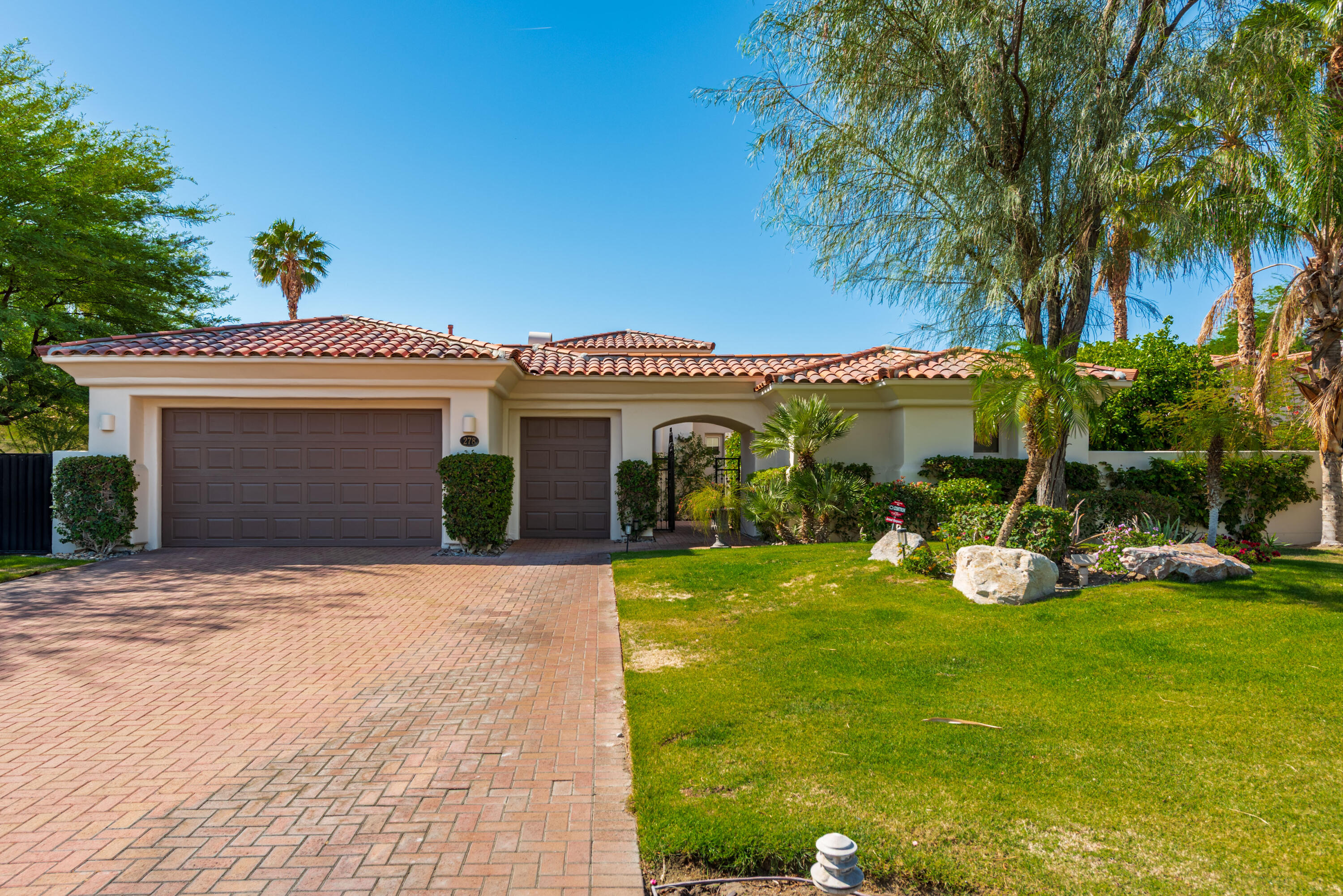 278 Loch Lomond Road Rancho Mirage, CA 92270 - Photo 5 of 49 a view of a house with backyard porch and garden